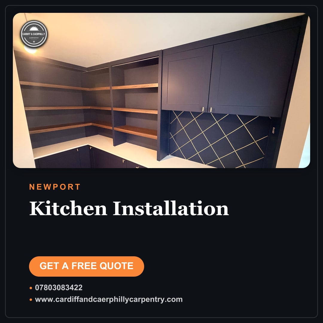Corner fitted home office with navy blue cabinets, white countertop desk, and wooden open shelving units.