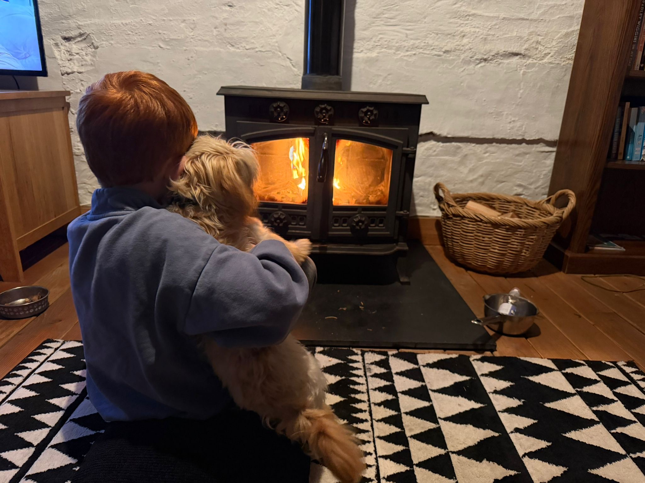 Family trip away to Tenby Harri and Teddy by the open fire