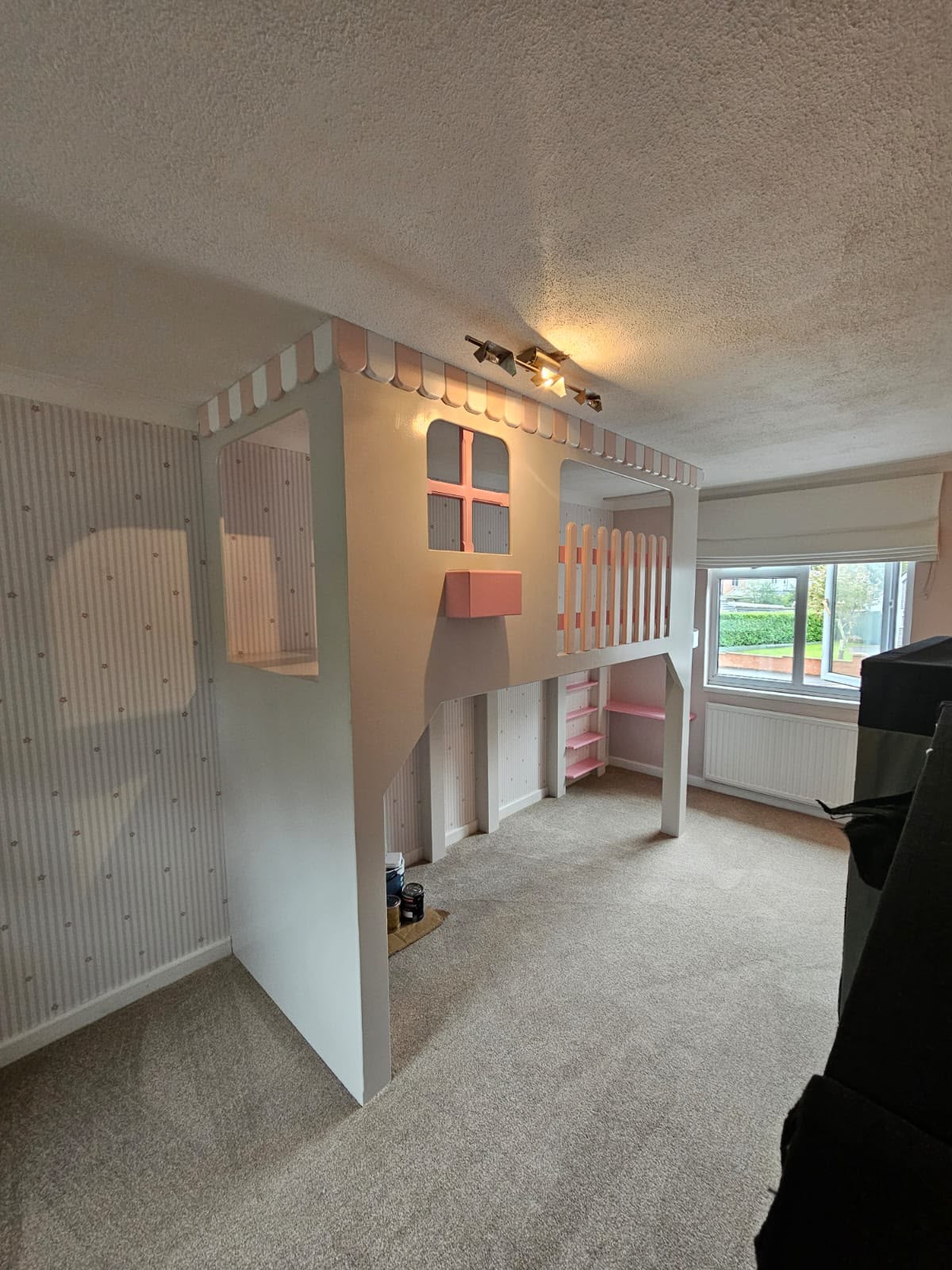 Bespoke cabin bed built wall to wall, leaving open play space underneath